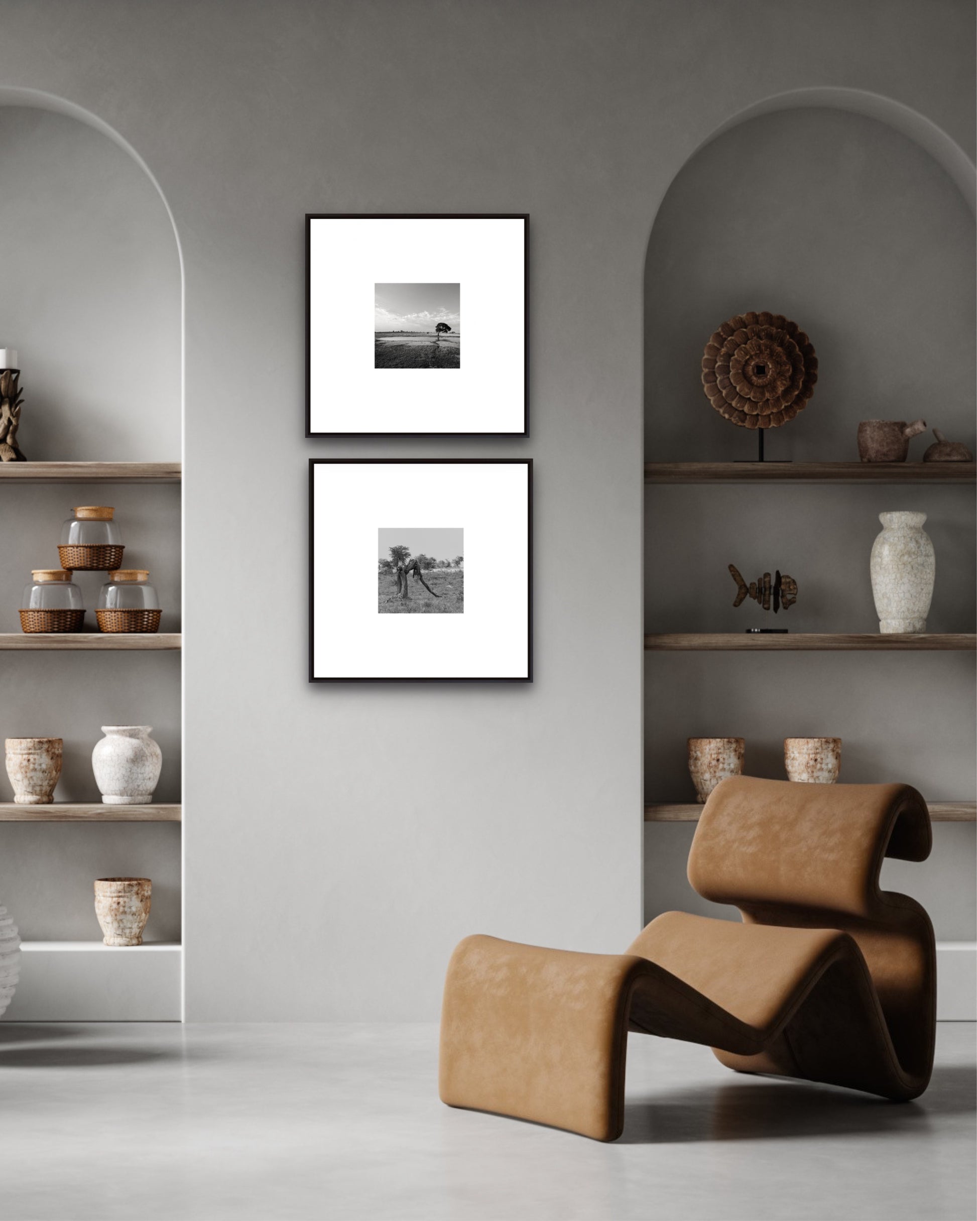 Modern interior with a brown chair, framed pictures, and shelves with decorative items.